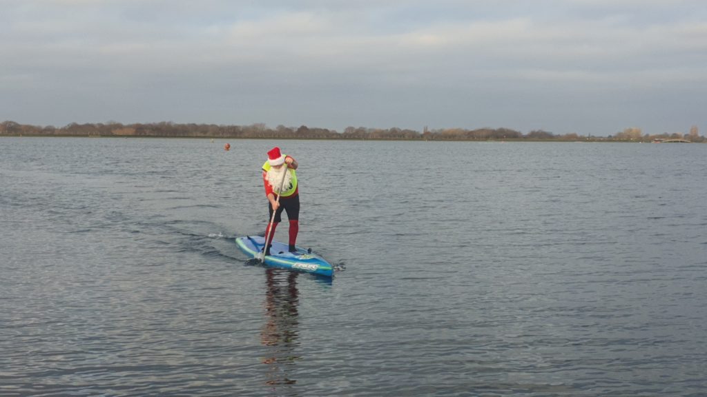 Santa at Speed on a paddlebaord