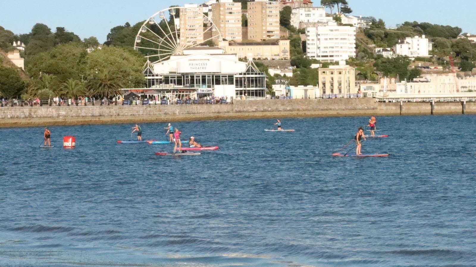 AquaPaddle with Torquay in the background